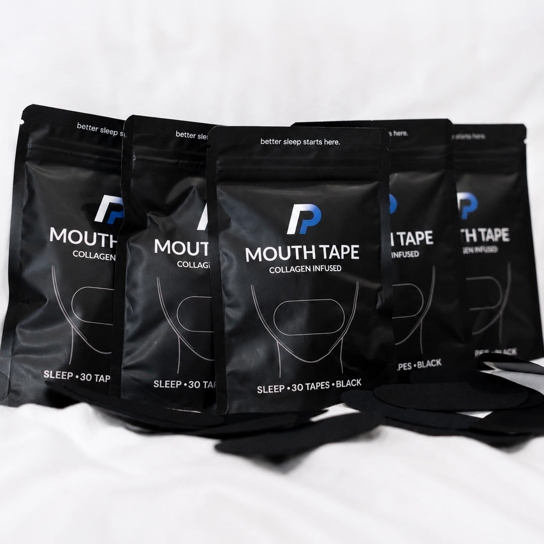 Five mouth tape packs arranged with black mouth tapes