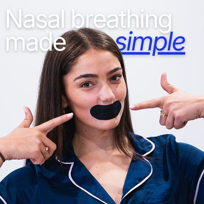 Woman pointing to black mouth tape on her lips