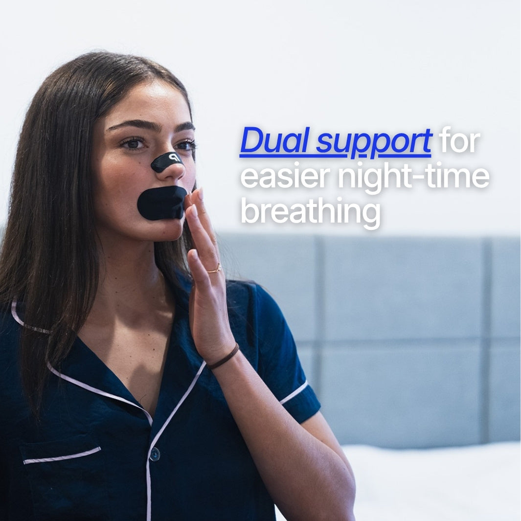 Woman in blue pyjamas applying black mouth tape
