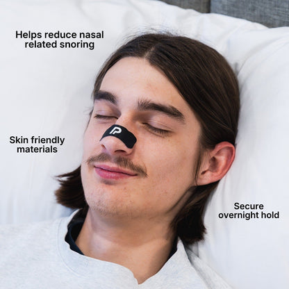 Man wearing a black nasal strip to support easier nasal breathing